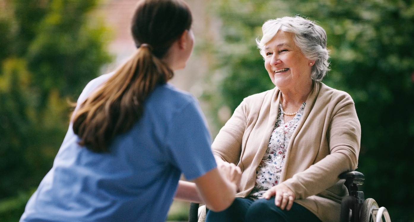 Shot of a senior woman in a wheelchair being cared for a nurse